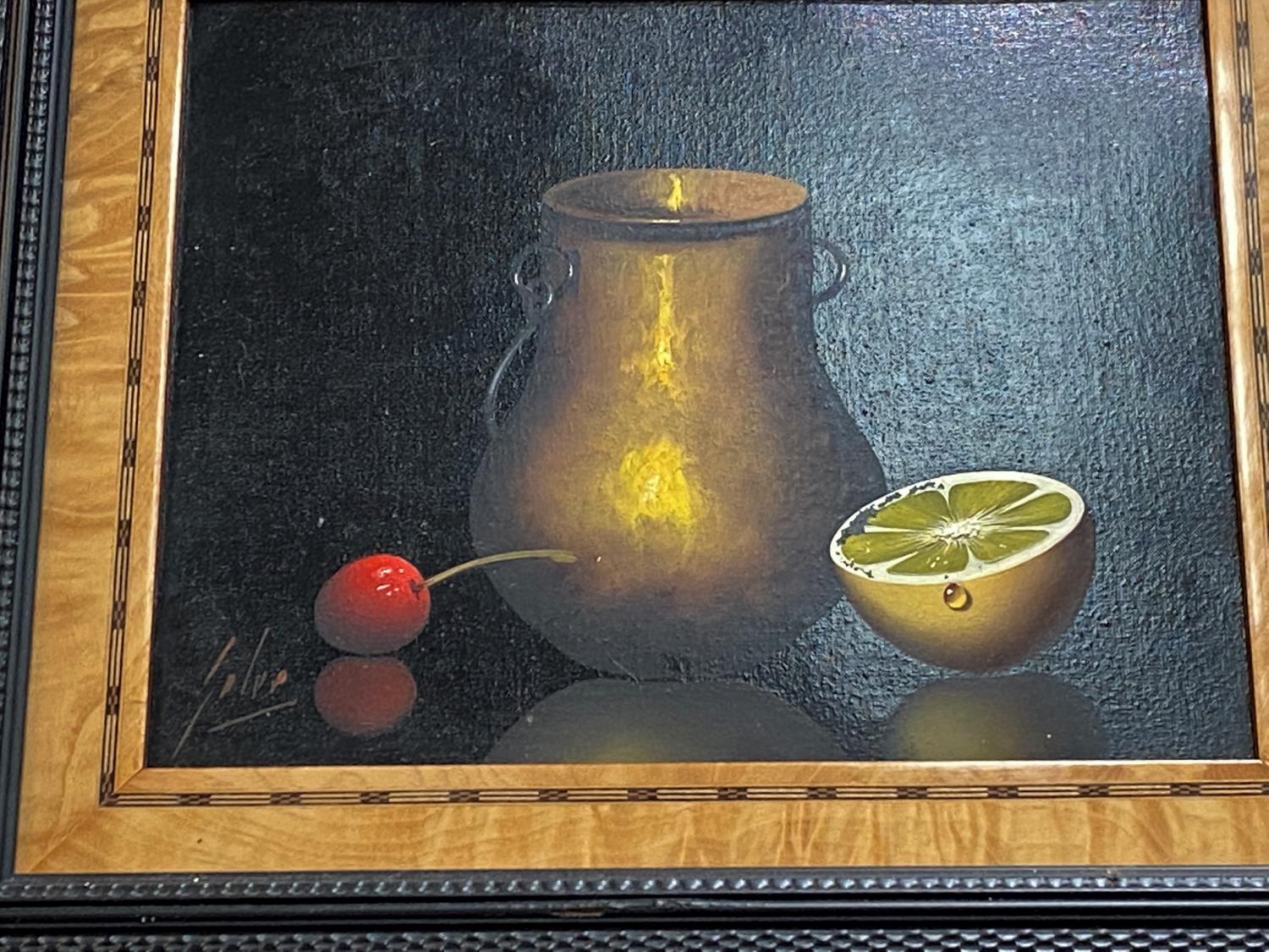 A 20th century still life of 1/2 a lemon, cherry & a vase/cup, a pair of oils on board, signed - Image 2 of 3