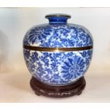 A Chinese blue and white lidded bowl decorated with vines etc, with brass bindings around rims 25.