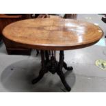 Victorian occasional table with quarter veneered and inlaid oval top, on 4 legs and splay feet