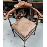 An Edwardian inlaid mahogany corner armchair in the Sheraton style