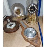 Two aneroid barometers and two clocks