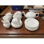 A Mintons Victoria Strawberry eight setting tea service with teapot, milk jug, sugar, cups and