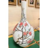 A Chinese bulbous slender neck vase, possibly Republic period decorated in polychrome with flowering