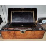 A 19th century brass bound walnut lap desk with fitted interior