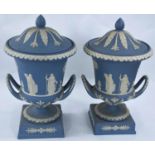 A Wedgwood light blue Jasperware pair of urn shaped vases with covers, height 30 cm