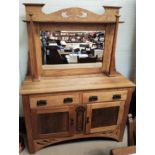 An Arts & Crafts oak sideboard with mirror back, square pillars, 2 side cupboards and 2 drawers