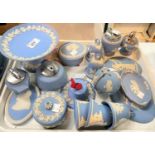 A selection of Wedgwood light blue Jasperware:  bells; covered trinket pots; table lighters; etc.