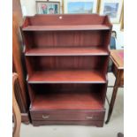 A mahogany pair of 4 height bookcases in the 'waterfall' period style