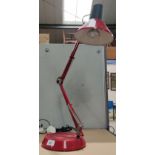 A red angle poise lamp