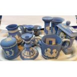 A selection of Wedgwood light blue Jasperware:  clock; loving cup; candlesticks; etc.