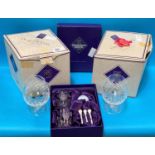 An Edinburgh glass golf gift set and four boxed brandy glasses.