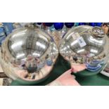 Two large silvered witch's balls