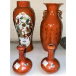 A pair of small Chinese vases of compressed baluster form, naturalistic decoration on orange