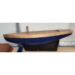 A scratch built wooden pond yacht, length 76cm