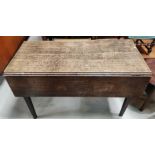 An 18th century oak kitchen table with rectangular drop leaf top, length 115cm