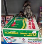 A vintage Toy Town set, Alpine Climbing Choo-Choo, boxed; a Velodrome Scalextric; a vintage monkey
