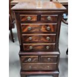A reproduction Regency mahogany dwarf chest on chest with 8 drawers