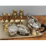 A three piece silver plated tea service and a selection of brassware etc