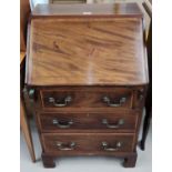 An Edwardian inlaid mahogany bureau with fall front and 3 drawers, on bracket feet