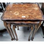 A nest of 3 walnut occasional tables; a reproduction coffee table; a standard lamp