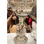 A 19th century continental porcelain floral encrusted table centre with fruit bowl, applied figures,