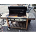 A "Mate" gas barbecue on integral trolley stand