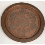 A 19th century Islamic heavy copper circular dish overlaid in silver, 32cm