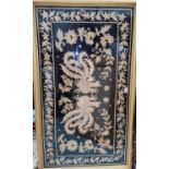 A central Asian foil thread embroidered panel depicting mythical birds, 62 x 114cm, framed