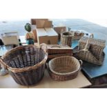 A large woven basket; 3 others; 2 picnic baskets