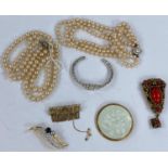 Two pearl necklaces, one 3 strand, one 2 strand and a small selection of various brooches etc