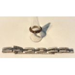 A 9 carat hallmarked gold eternity ring set alternating clear/red stones, 3.3 gm; an Art Deco