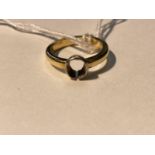 A yellow metal ring, stone missing, tests as 18 ct, 5.4 gm