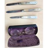 Three hallmarked silver and mother-of-pearl fruit knives; a gilt pair of vintage spectacles
