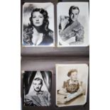 An album of 'Film Favourites' some originally signed, some facsimile, black and white postcards of