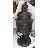 A Japanese bronze Koro of cylindrical form, the top with mythical figure on tripod support with