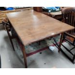 A 1960's G-Plan teak dining suite comprising extending table with rectangular top, and 4 chairs with