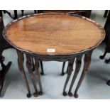 A reproduction Regency mahogany nest of 3 occasional table with oval tops