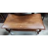 A walnut 2 tier rectangular coffee table; a matching nest of 2 tables