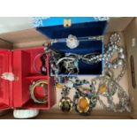 Two boxes containing various costume jewellery