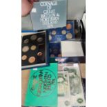 A collection of 8 coin sets including proof examples, various crowns and bank notes