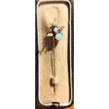 A yellow metal insect pin set opals and seed pearls, ruby coloured eyes, stamped '9ct', boxed, 0.8