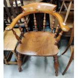 A late 19th/early 20th century pair of near matching smokers bow armchairs