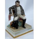 NAPOLEON BONAPARTE, a continental porcelain figure with Napoleon seated, 24cm