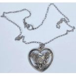 Georg Jensen:  a silver pendant/necklace, the pierced heart shaped drop with bird, wings