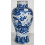 A Chinese blue and white inverted baluster vase decorated with flowers etc. height 22cm