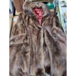 A full length brown fur coat, another faux fur coat and a selection of lace and linen etc