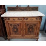 A 19th century French oak side cabinet fitted cupboard and two short drawers, carved decoration,