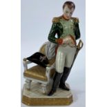 NAPOLEON BONAPARTE,  a continental porcelain figure with Napoleon standing beside a chair, 23cm