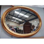 A woven fibre painted linen basket; an oval mirror in lacquered frame; a similar gilt framed mirror;