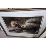 A limited edition print of a leopard by D P Hierrve, framed and glazed; a rectangular gilt framed